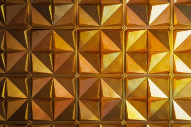 Altın üçgen arka plan veya doku. Soyut mimari desen