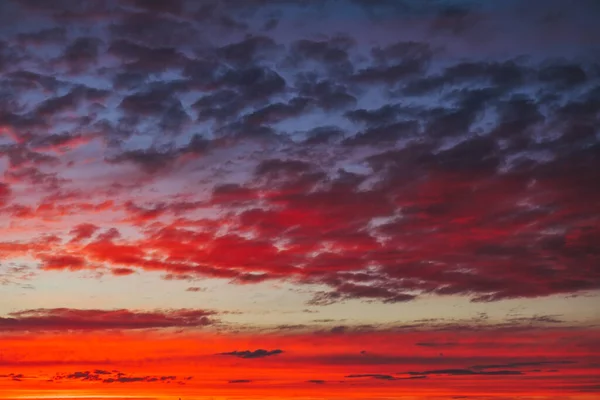 Beautiful Twilight sky background. Colorful Fiery orange and red sunset sky.