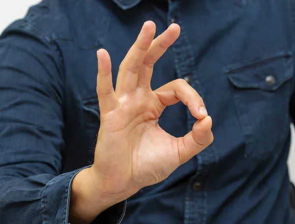 a combination of fingers means ok male brush