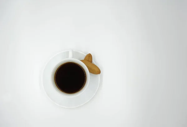 Cup of coffee with biscuits on white background — Stock Photo, Image