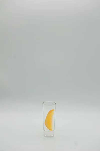 Shot with piece of orange on white background — Stock Photo, Image