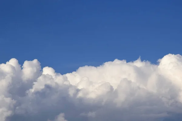 Blue sky with clouds background. Sky with cumulus clouds. Big ai