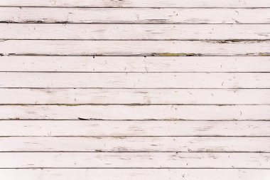 Eski ahşap bir masanın boyası soyuluyor.