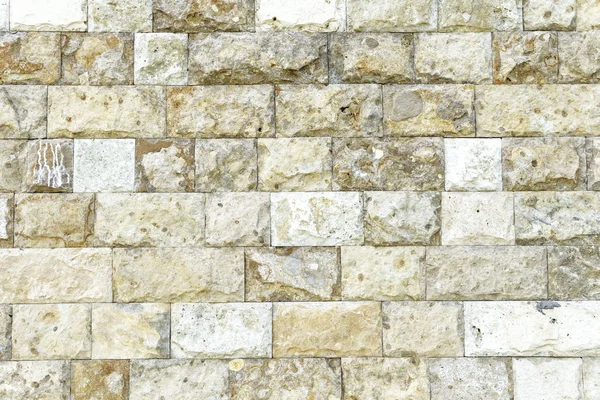 Античная стена из натурального камня, состоящая из различных камней для дизайна — стоковое фото