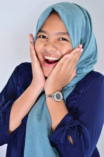 Portrait of happy asian girl wearing blue hijab smile at you a — Stok Foto