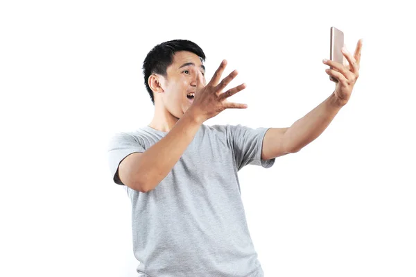 Excited expression on front of a smartphone. Portrait of happy a — Stock Photo, Image