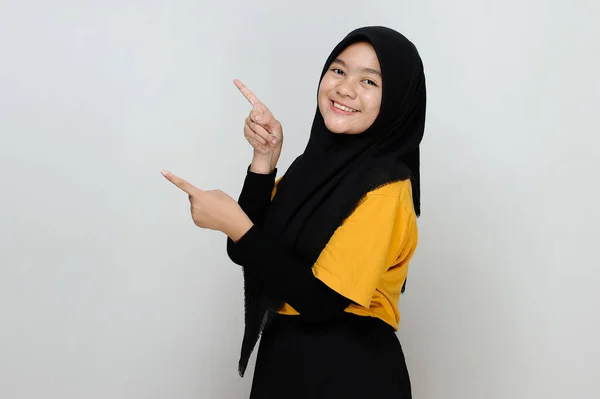 Young Beautiful Muslim Asian Teenager Happy Pointing Copy Space Isolated — Stock Photo, Image