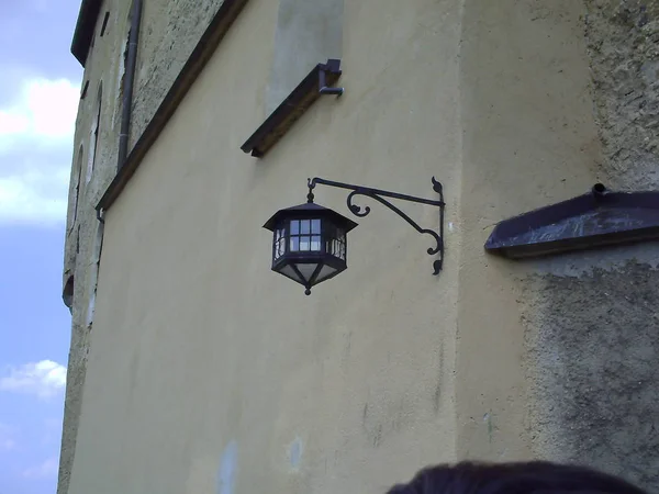 Lantern in the old royal castle. Old lantern on the stone wall of the old castle — Stock Photo, Image