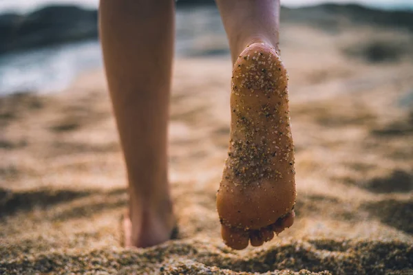 Sand on feet sole