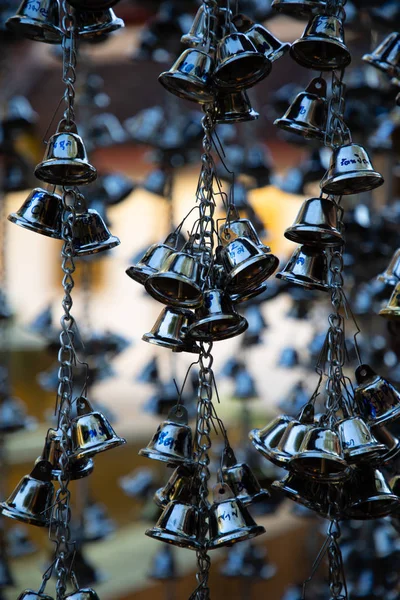 Close up of a group of hanging black bells in a thailand temple — Stock Photo, Image