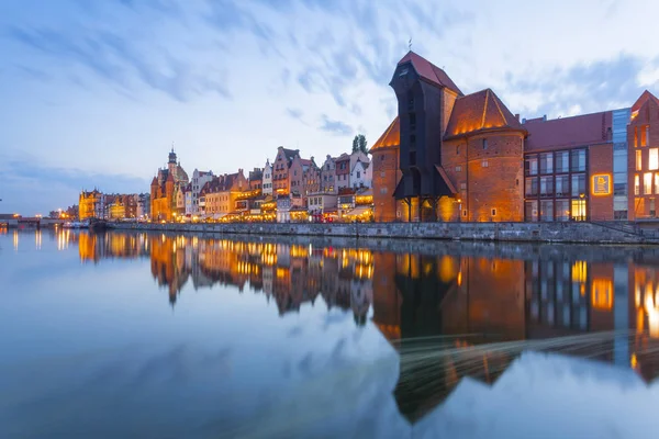 view of Gdansk buildings lighting on riverside at evening, Poland