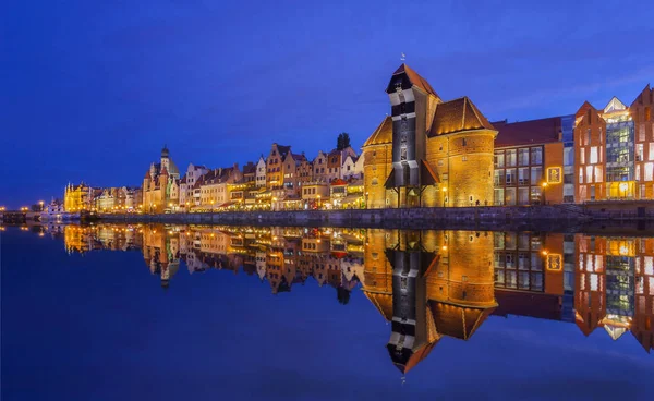 view of Gdansk buildings lighting on riverside at evening, Poland