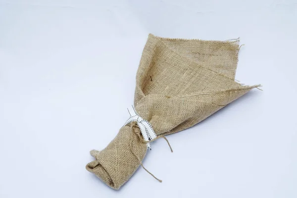 An empty gunny sack bouquet  on isolated white background. Love concept.