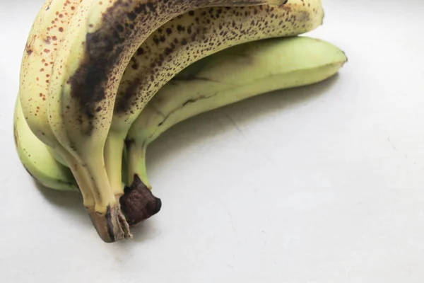 Old bananas on stone background