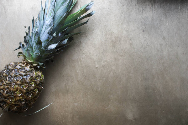 Cut pineapple on wooden board