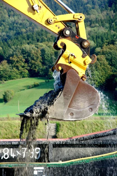 Yellow Excavator for water and mud — Stock fotografie