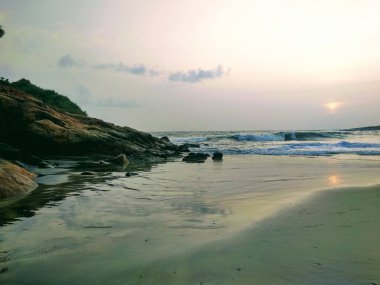 Gün batımı manzarası, Kovalam plajı, Kerala. Tanrı'nın kendi ülkesi.
