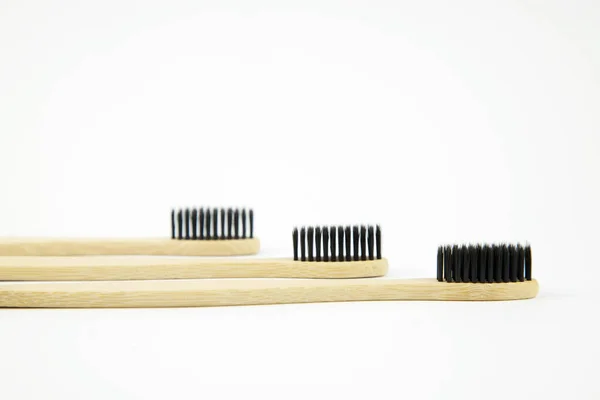 Three Bamboo Eco Toothbrushes Natural Bristles Lie White Background Refusal — Stock Photo, Image