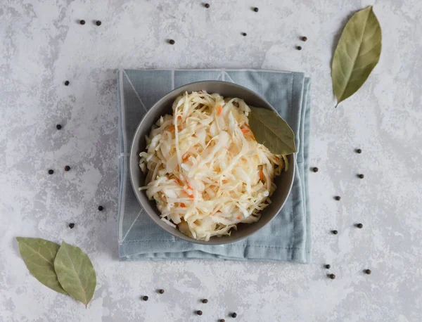 Top view of a gray teatka or bowl with sauerkraut or salted cabbage. Preparations for the winter. Place for text. — Stock Image Top View Gray Teatka Bowl Sauerkraut Salted Cabbage Preparations Winter Stock Photo
