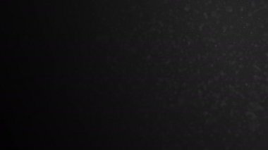 Organik toz Dof görüntü üzerinde siyah arka plan ile havadaki akan. kayan nokta parçacıklar Bokeh ile 3d animasyon. 4 k Ultra Hd 3840 x 2160