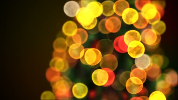Draaien van de kerstboom verlichting flikkerende Close-up in Blur Bokeh. Lus 3d animatie. Geanimeerde groet Card. prettige kerstdagen en gelukkig Nieuwjaar Concept. 4 k Ultra Hd 3840 x 2160 — Stockvideo