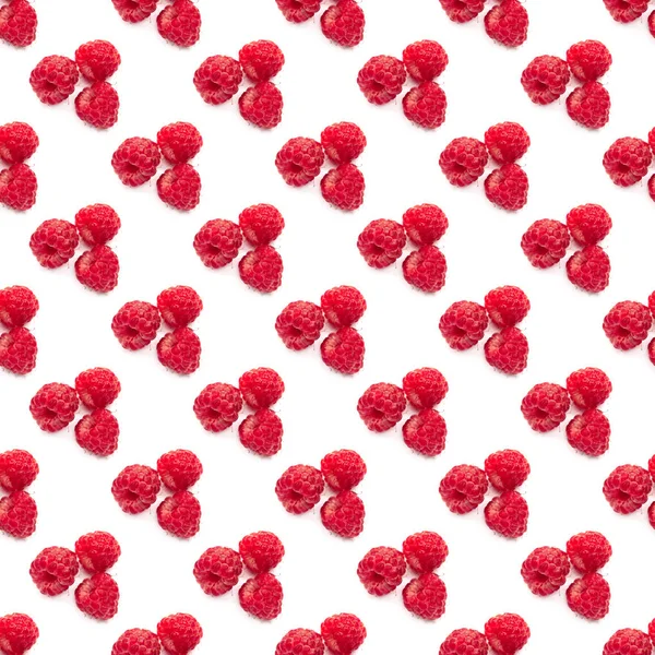 Große Beeren von roten frischen Himbeeren auf weißem Hintergrund. Muster für eine nahtlose Textur. — Stockfoto