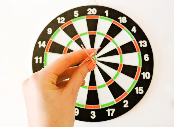 . Success hitting target aim goal achievement concept background.Darts and dart board.Close up shot of the dart arrow.Marketing concept. Dartboard.