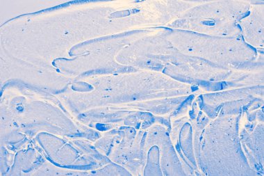 Beyaz arka plan üzerinde izole çok renkli kozmetik Sıvı jel. Kozmetik doku. Profesyonel makyaj ürünleri. Jel kabarcıklar doku üst görünümü. Kozmetoloji, spa. Cilt Bakımı.Yüz ve vücut için krem.