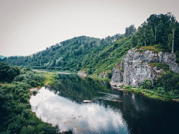 Forest river .Top view summer. Landscape with mountains Summer nature river landscape.Mountain river flowing through the green forest.