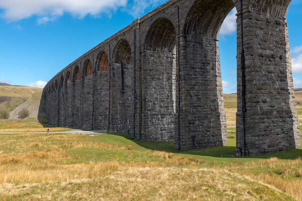 The sweeping majestic Ribblehead Viaduct stands tall above the Ribble Valley, Yorkshire, England carrying the Settle to Carlise railway