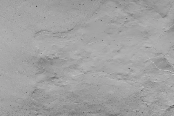 Bir dış dokulu duvar yakın bir fotoğraf beyaz kapalı boyanmış, sıva daub ile yüzey, arka plan için büyük