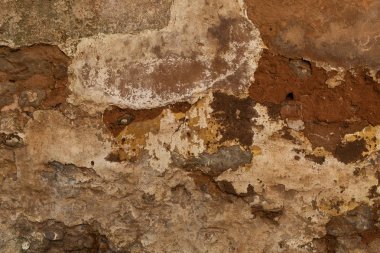 Duvar kağıdı veya arka plan için harika bir brink duvardan uzakta sıva çeşitli renklerde katmanları çatlak