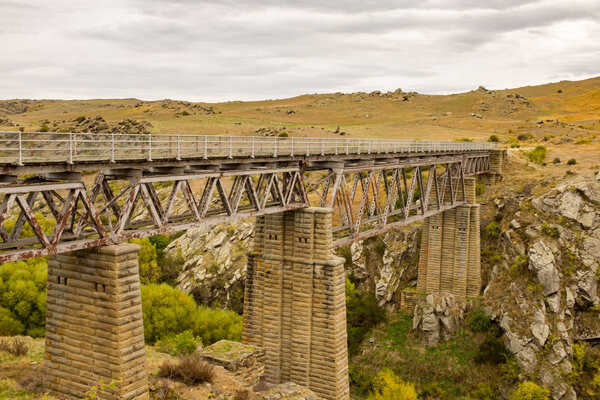 The historic stone viaduct bridge at Poolburn part of the Otago Rail Trail, cycle route, Otago, New Zealand