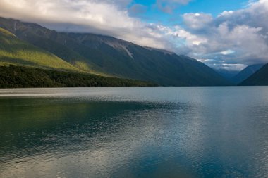 Scenic view of Rotoiti Lake surrounded by mountains in Nelson Lakes National Park, New Zealand  clipart