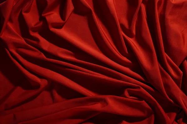 Achtergrondbeeld van verfrommeld weefsel. Rode doek — Stockfoto