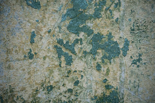 Textura de una vieja pared cubierta de pintura. Imagen de fondo de una —  Fotos de Stock