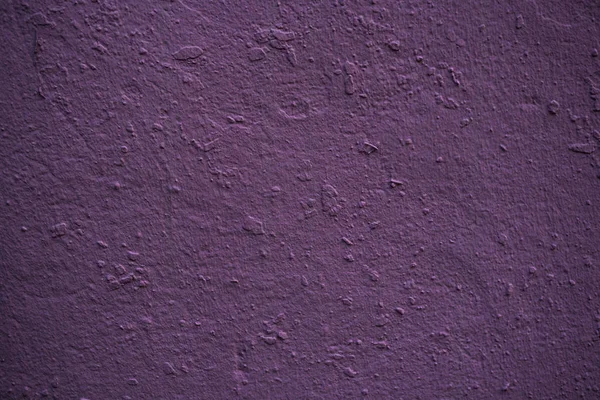 Textura de uma parede velha coberta de tinta. Imagem de fundo de um — Fotografia de Stock