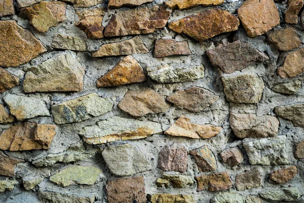 The texture of the old masonry. Background image of a stone-line — Stock Photo, Image