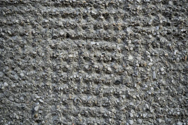 Textura de uma antiga parede de concreto rachado. Imagem de fundo de um w — Fotografia de Stock