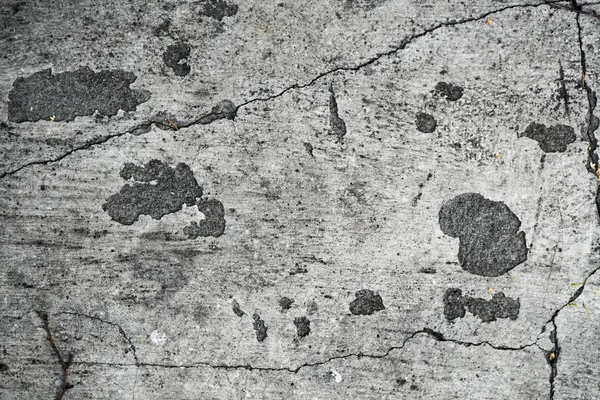 Texture di un vecchio muro di cemento incrinato. Immagine di sfondo di un w — Foto Stock
