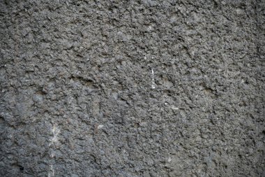 Eski bir çatlak beton duvarın dokusu. W'nin arka plan görüntüsü