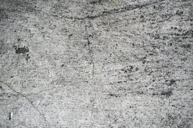 Eski bir çatlak beton duvarın dokusu. W'nin arka plan görüntüsü