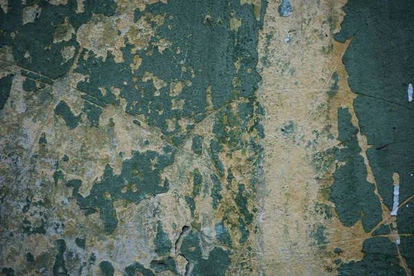 Textura de una vieja pared cubierta de pintura. Imagen de fondo de una —  Fotos de Stock