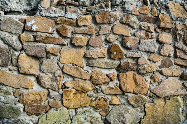 The texture of the old masonry. Background image of a stone-line — Stock Photo, Image