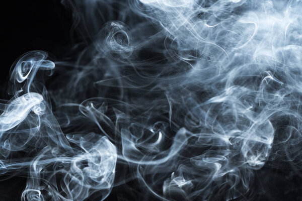 Photo of a wisp of smoke on a dark background