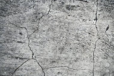 Eski bir çatlak beton duvarın dokusu. W'nin arka plan görüntüsü