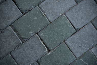 Texture of paving slabs overgrown with grass. Background image of a stratum stone clipart