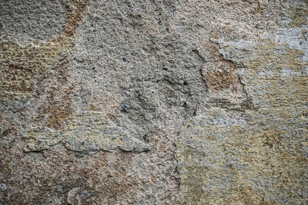 Textura de uma parede velha coberta de tinta. Imagem de fundo de um — Fotografia de Stock