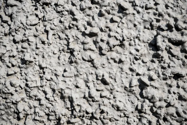Texture photo of white rough concrete plaster