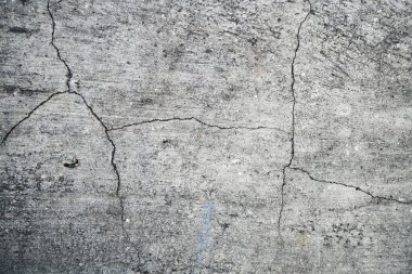 Eski bir çatlak beton duvarın dokusu. W'nin arka plan görüntüsü